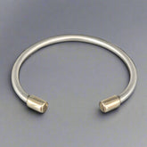 torc braclelet with gold cap end  - doyle design dublin